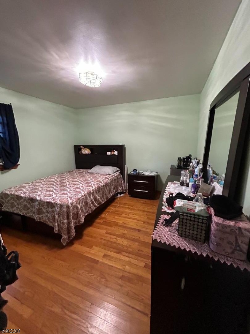 328 West Inman Avenue Rahway, NJ 07065 - Photo 7 of 9 a bedroom with double bed and a dresser