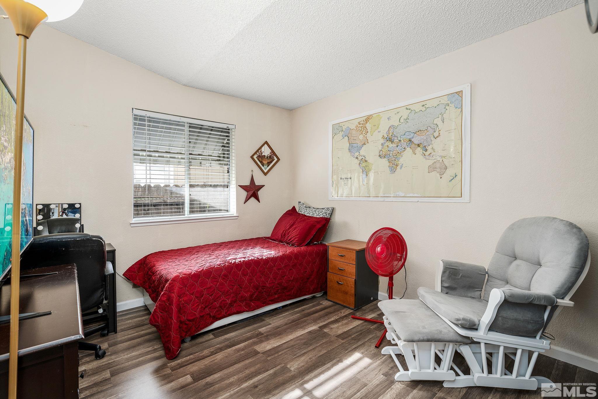 7630 Water View Way Reno, NV 89511 - Photo 16 of 25 a bedroom with a bed and a window