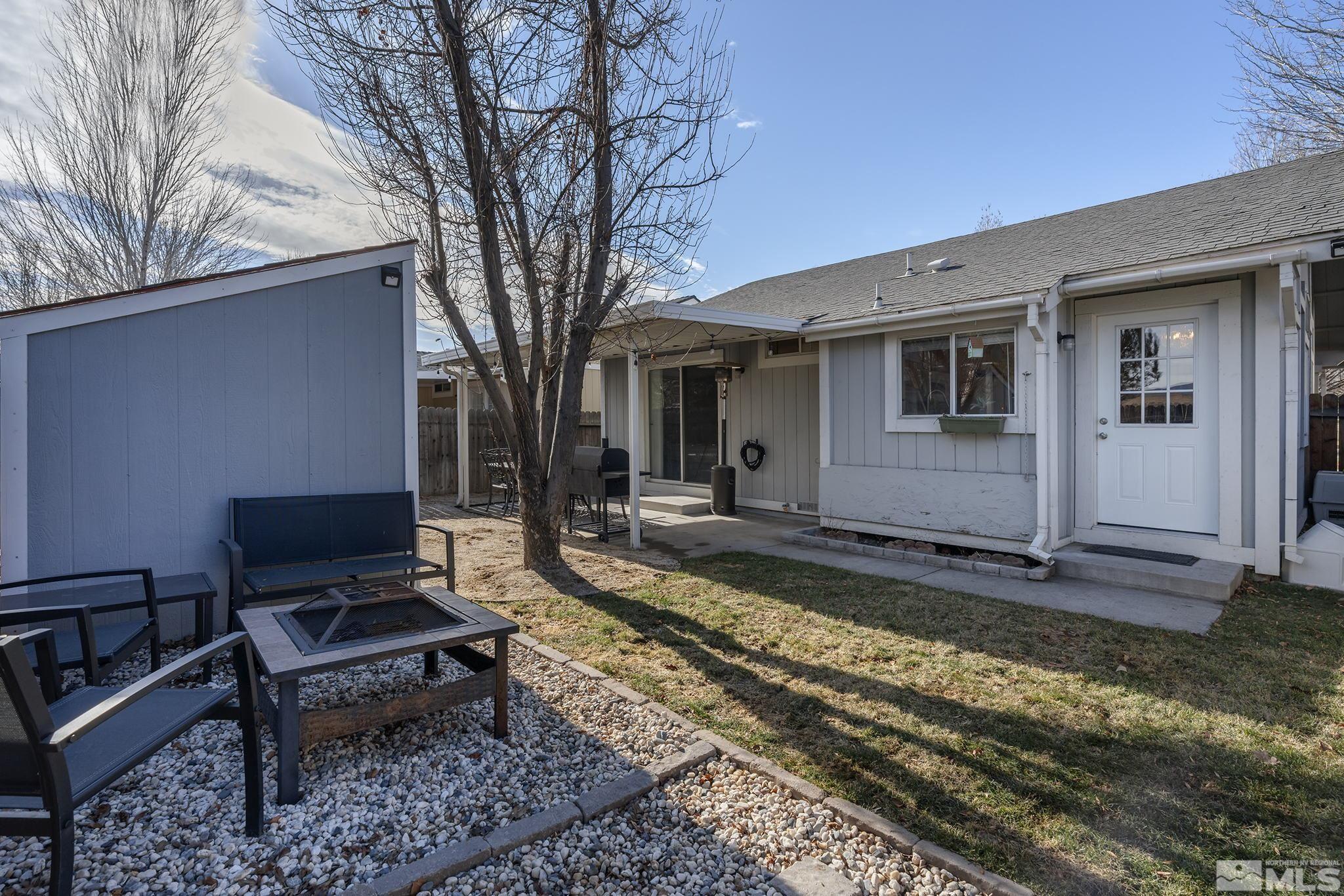 7630 Water View Way Reno, NV 89511 - Photo 25 of 25 a view of a backyard with a sitting area and a fire pit