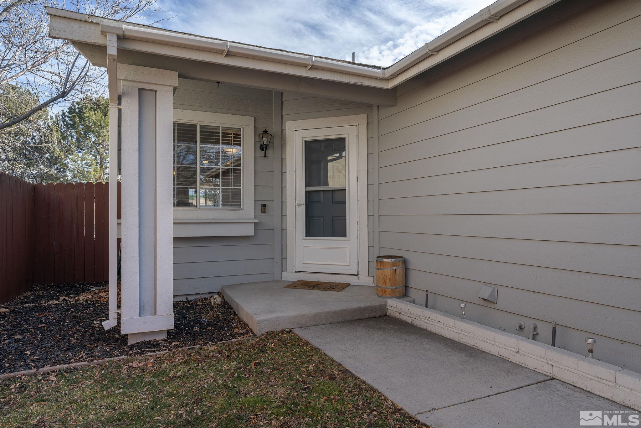 7630 Water View Way Reno, NV 89511 - Photo 4 of 25 a front view of a house with a yard