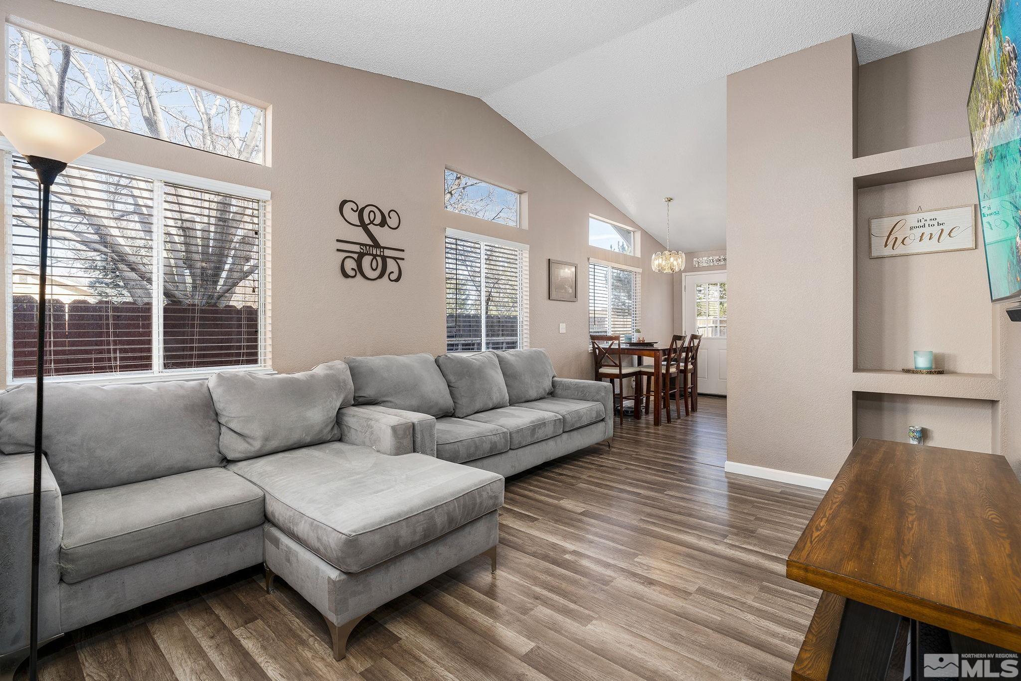 7630 Water View Way Reno, NV 89511 - Photo 5 of 25 a living room with furniture and a large window