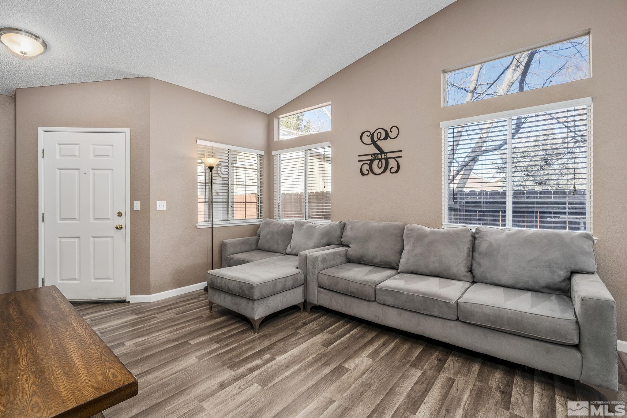 7630 Water View Way Reno, NV 89511 - Photo 6 of 25 a living room with furniture and a large window
