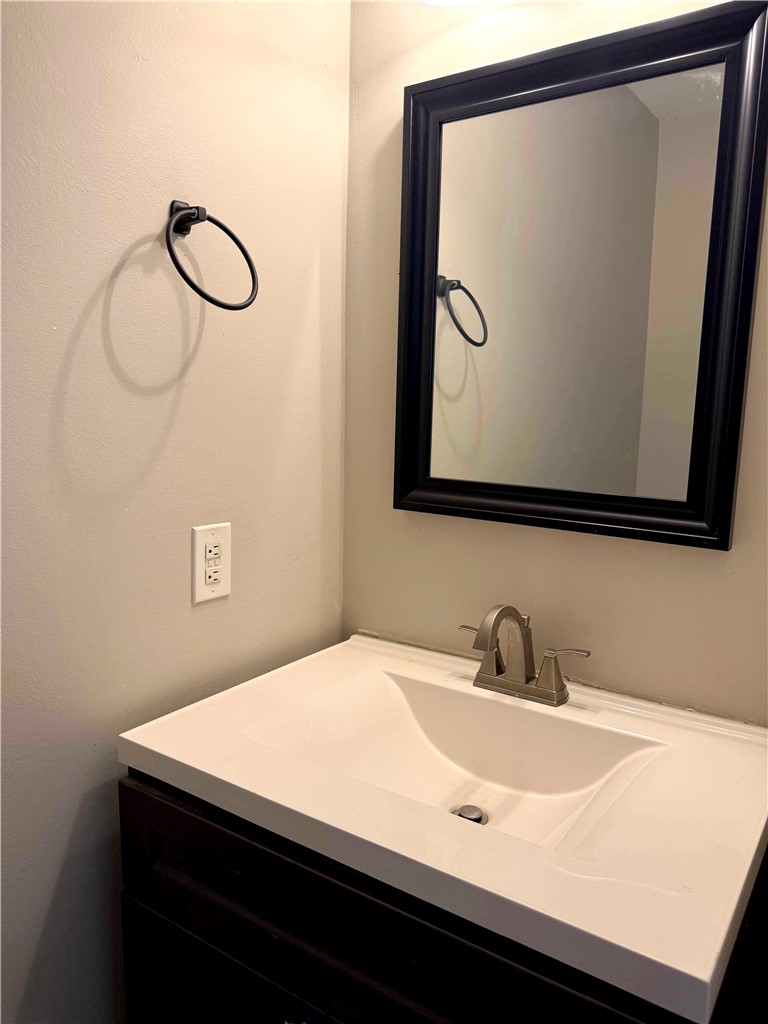116 Kelly Lane Easley, SC 29642 - Photo 18 of 39 A modern vanity with a dark wood cabinet anchors this functional bathroom space.