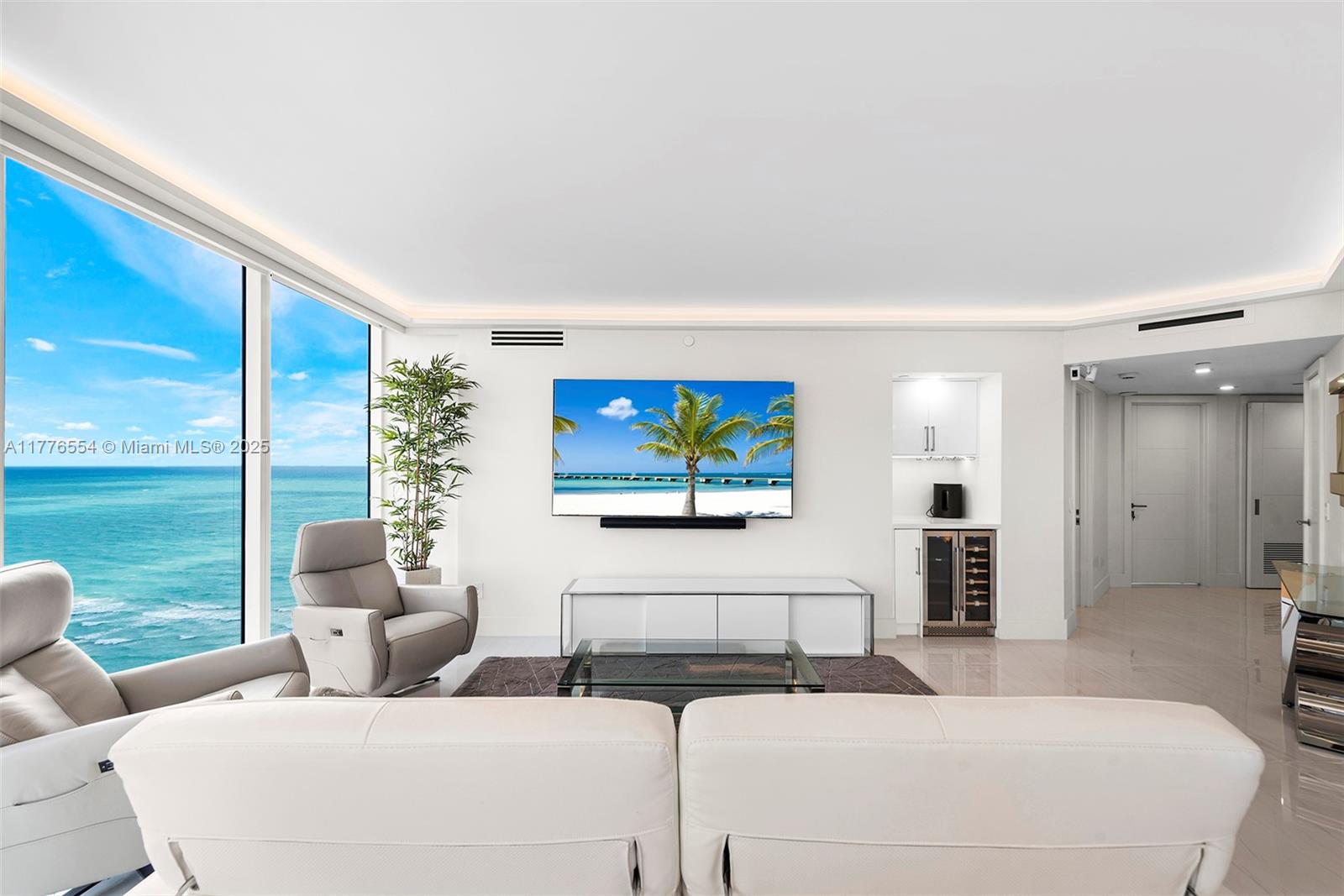 4775 Collins Avenue, Unit 2607 Miami Beach, FL 33140 - Photo 2 of 48 a bedroom with furniture and a large window