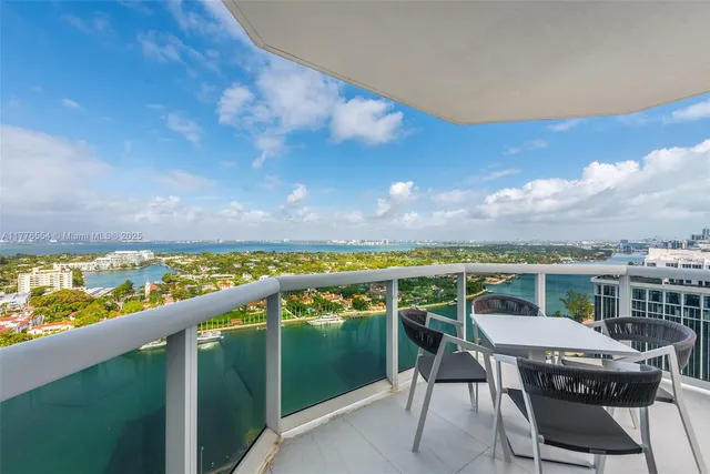 a view of a balcony with furniture