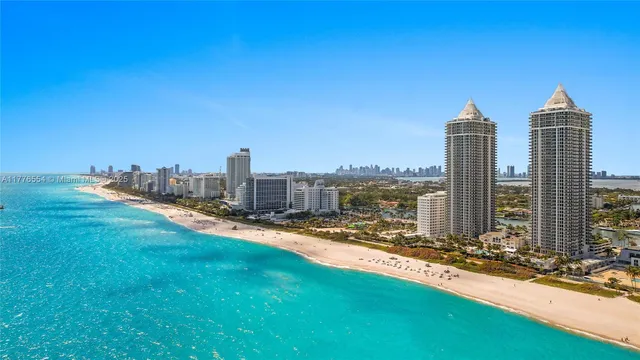a view of a city with tall buildings and a big yard