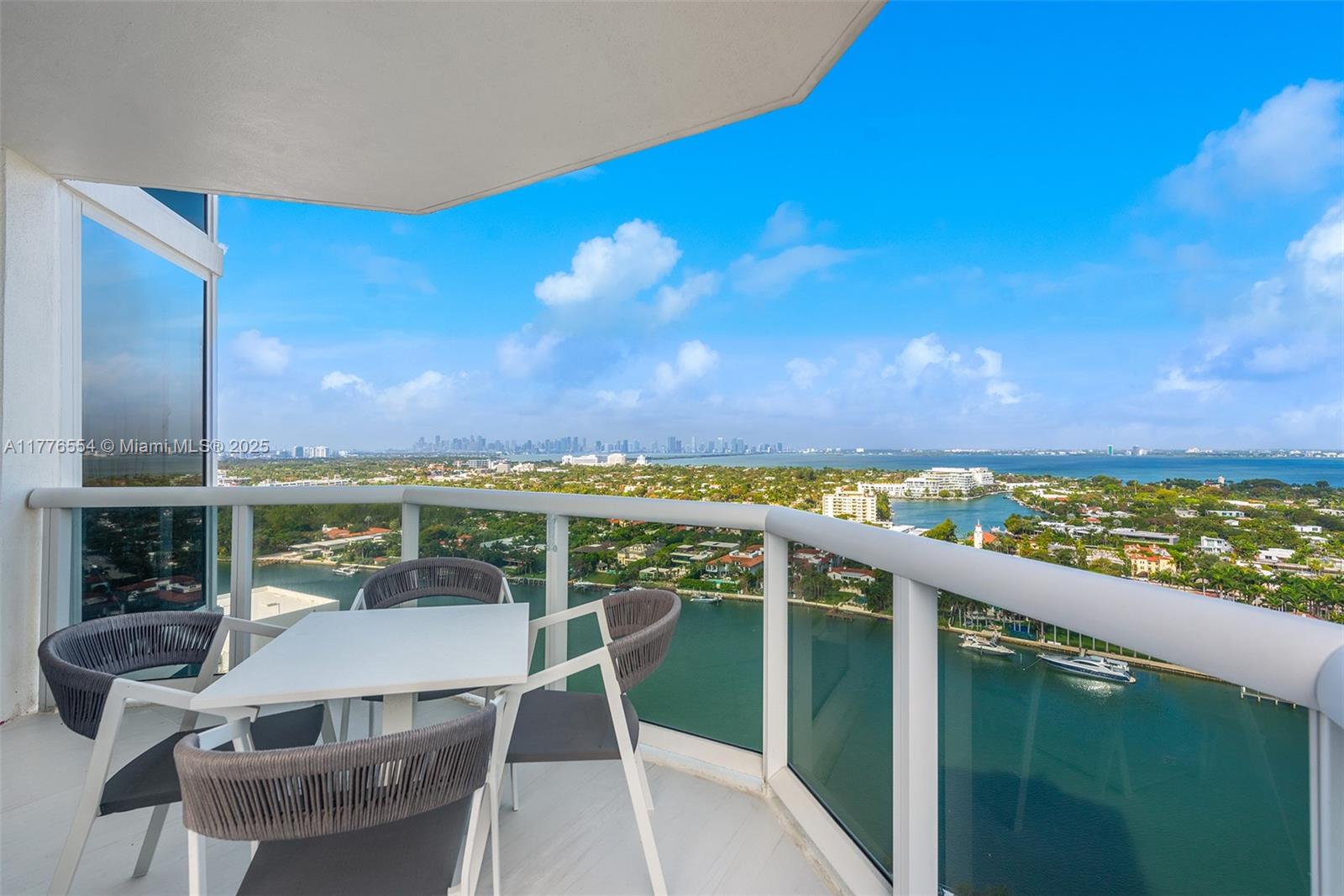 4775 Collins Avenue, Unit 2607 Miami Beach, FL 33140 - Photo 7 of 48 a view of a balcony with chair and table