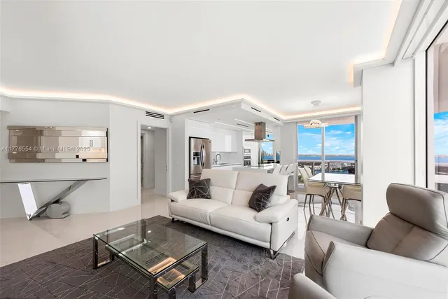 a living room with furniture and a table