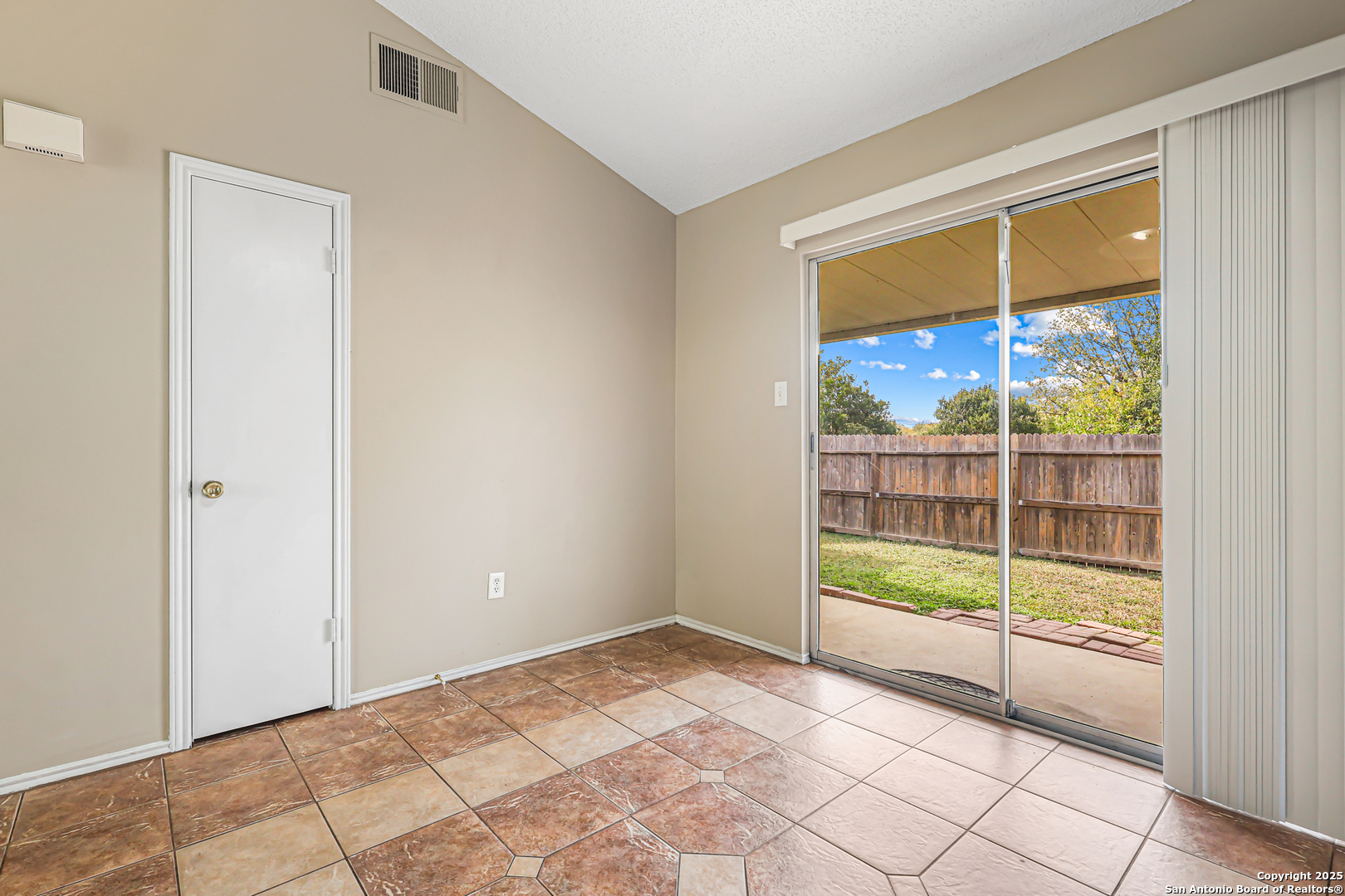 10254 Dover Ridge, Unit 806 San Antonio, TX 78250 - Photo 11 of 13 a view of an empty room and window
