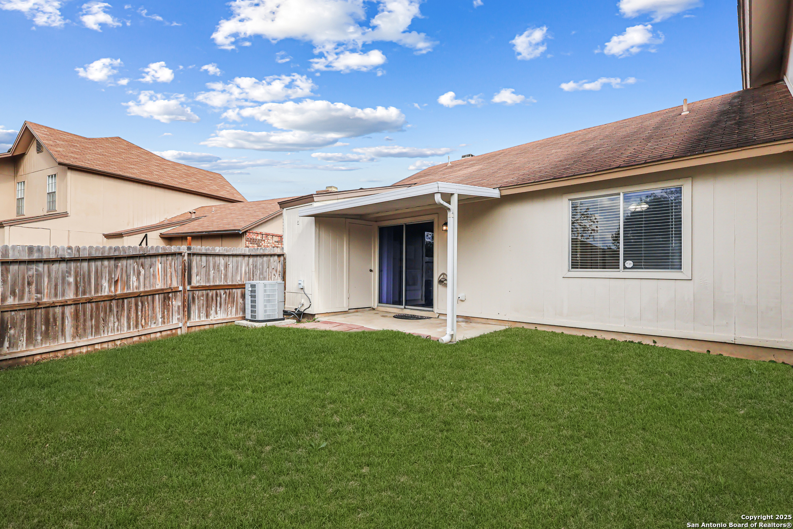 10254 Dover Ridge, Unit 806 San Antonio, TX 78250 - Photo 13 of 13 a view of an house with backyard porch and garden