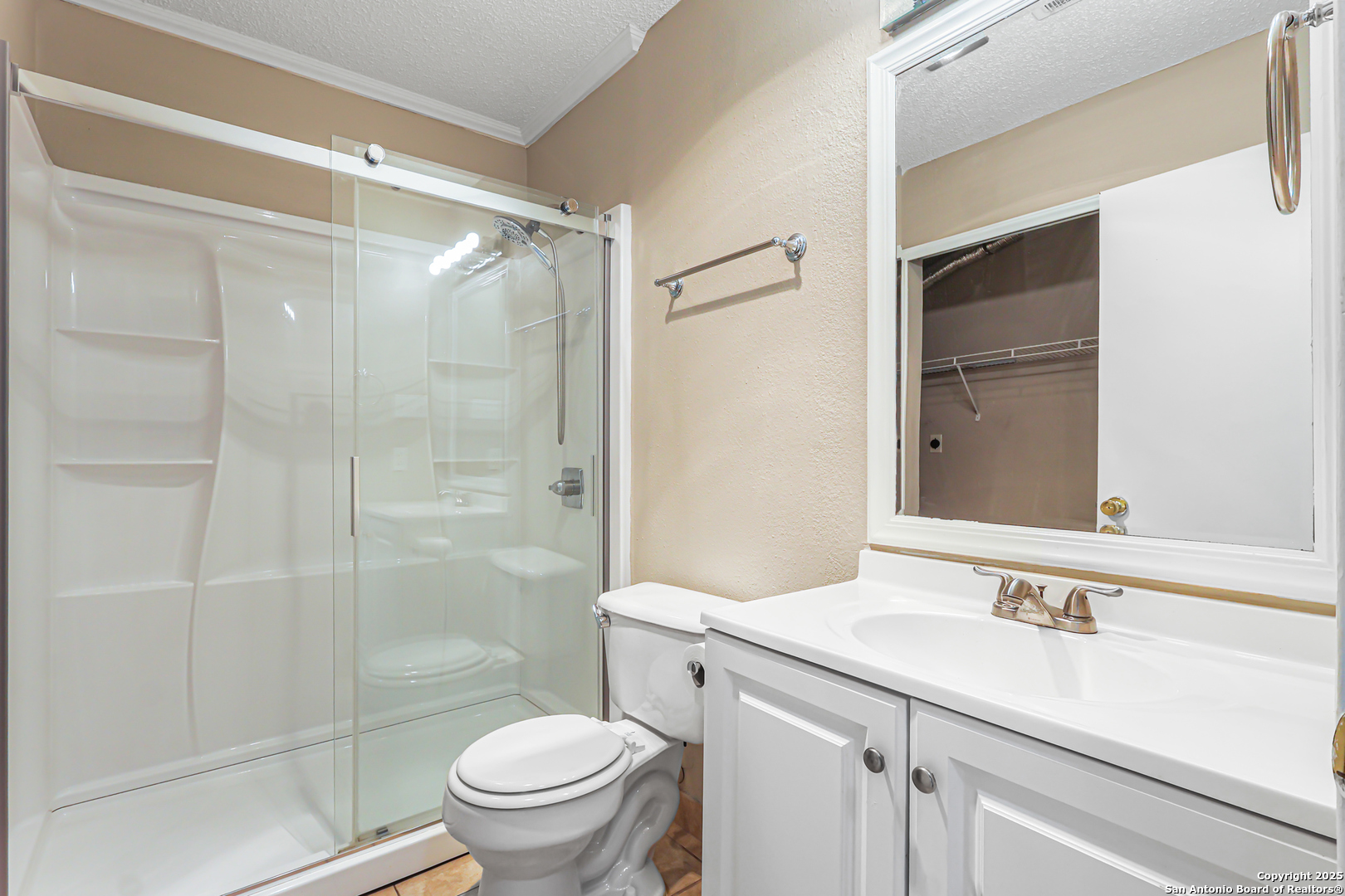 10254 Dover Ridge, Unit 806 San Antonio, TX 78250 - Photo 8 of 13 a bathroom with a sink and a mirror