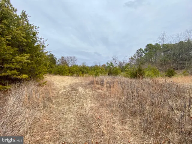 a view of lake with mountain in background