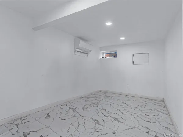 a white toilet sitting next to a bathroom sink