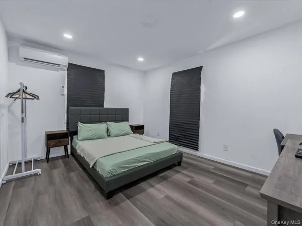 a bedroom with a bed and a walk in closet