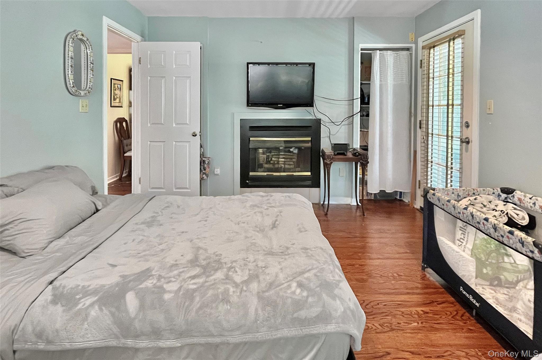 407 Arlin Road, Unit 407 Monroe, NY 10950 - Photo 25 of 33 #2 with fireplace & door leading to patio
