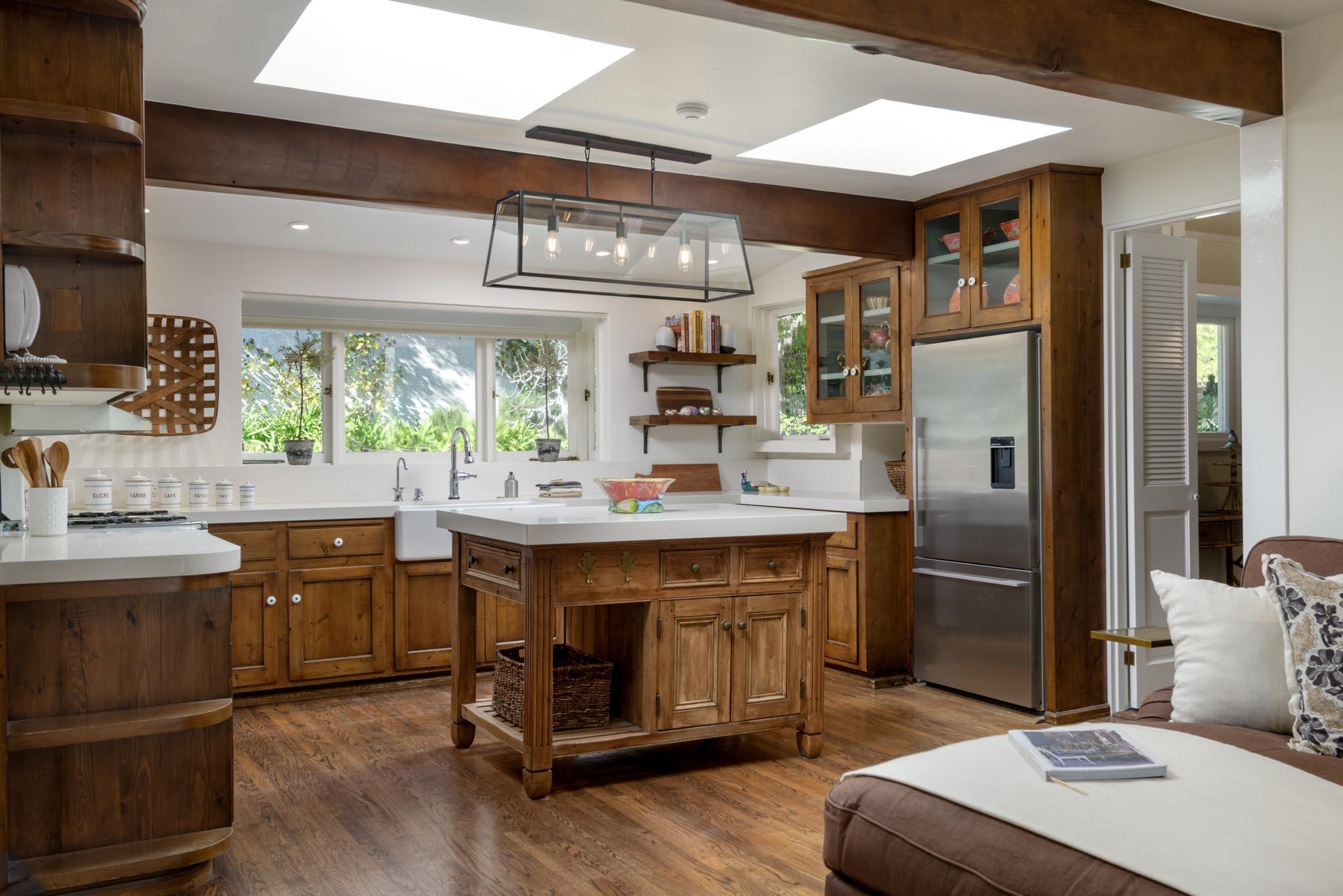 605 San Ysidro Road Montecito, CA 93108 - Photo 12 of 32 a kitchen with stainless steel appliances granite countertop a sink a stove and a refrigerator
