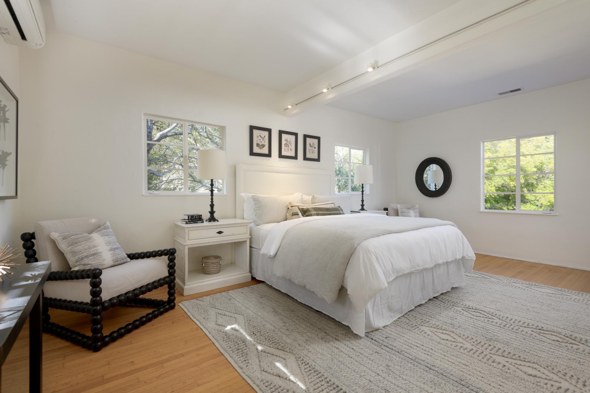 605 San Ysidro Road Montecito, CA 93108 - Photo 21 of 32 a bedroom with a bed and a couch