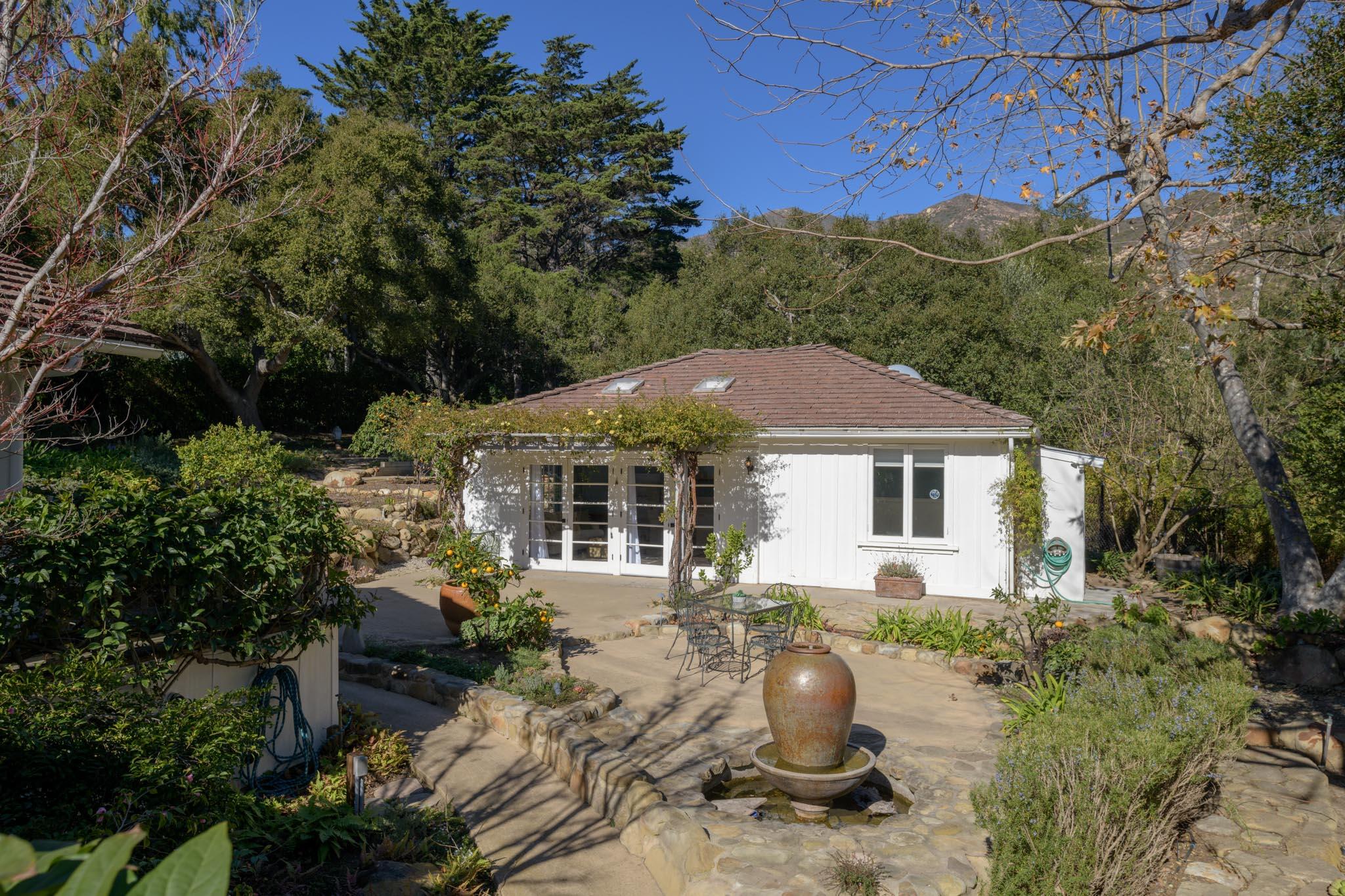 605 San Ysidro Road Montecito, CA 93108 - Photo 25 of 32 a view of a house with a yard