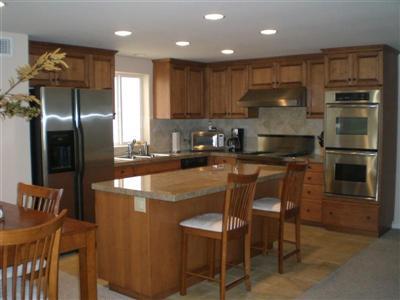 3511 Sunset Lane Oxnard, CA 93035 - Photo 4 of 9 a kitchen with kitchen island a counter top space cabinets and stainless steel appliances