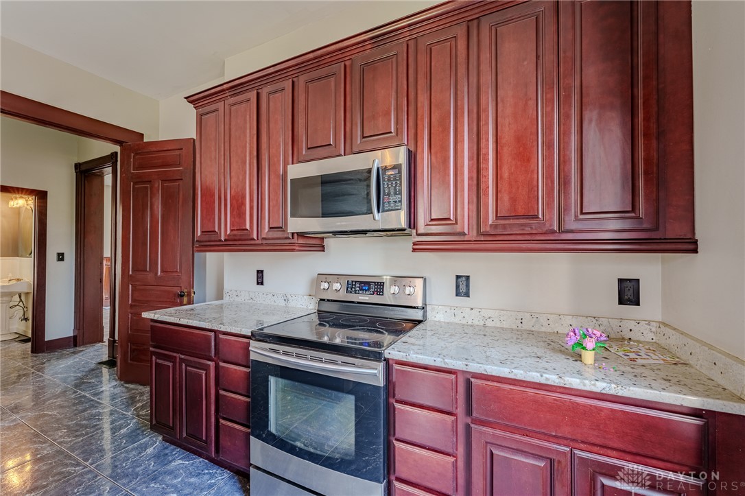 308 Yankee Road Middletown, OH 45044 - Photo 22 of 47 This kitchen showcases ample cabinet storage and modern appliances, perfect for culinary enthusiasts.