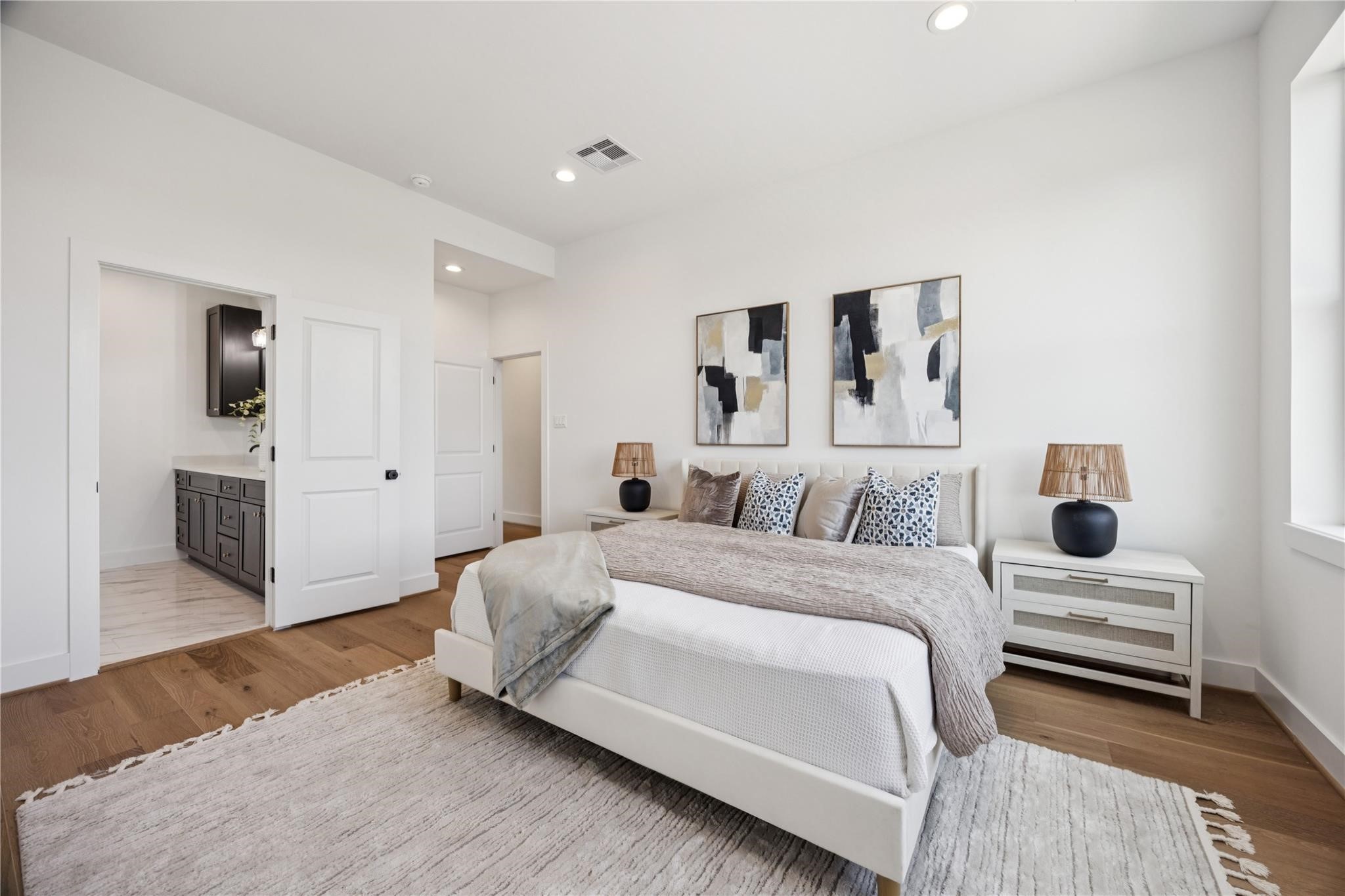 2810 Mills Street Houston, TX 77026 - Photo 16 of 29 a spacious bedroom with a bed and a couch