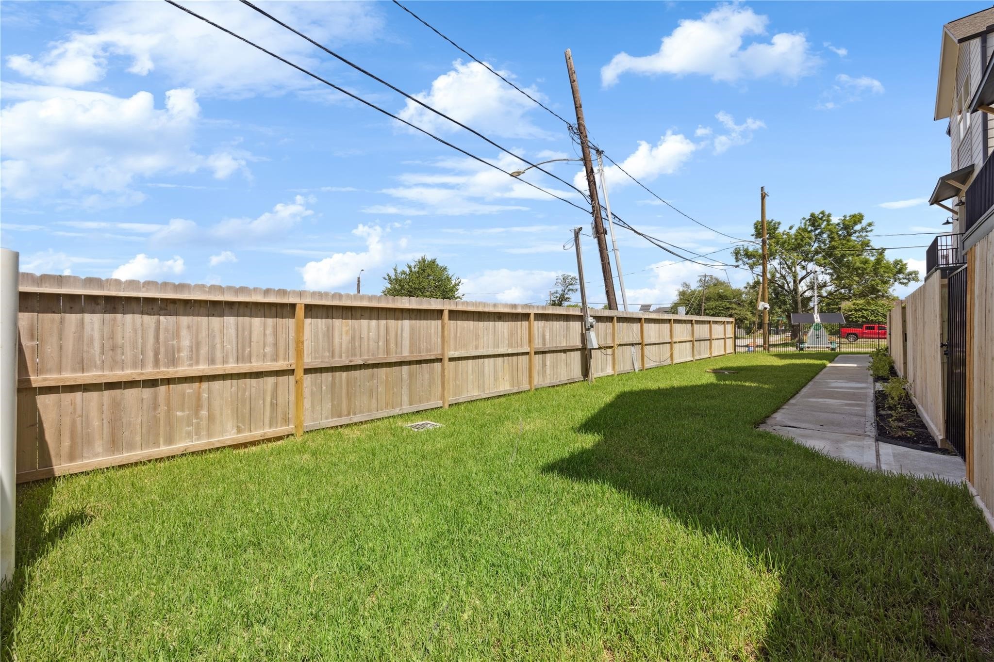 2810 Mills Street Houston, TX 77026 - Photo 29 of 29 a view of a backyard with grass & fence