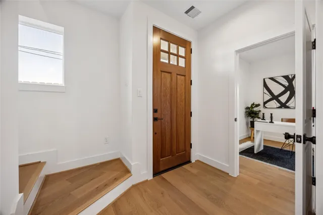 a view of livingroom with hardwood floor and hallway