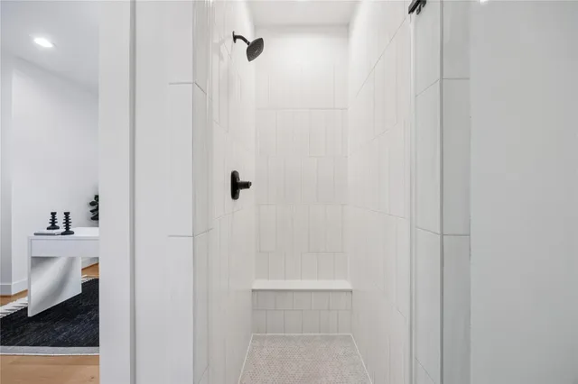 a large white kitchen with a large window