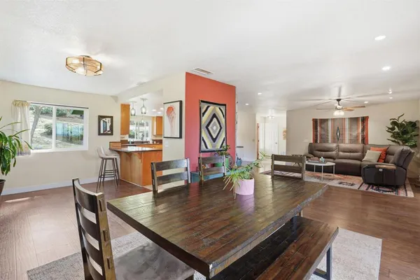 a view of a dining room with furniture window and wooden floor