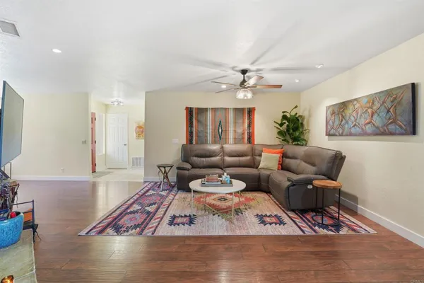 a living room with furniture and a fireplace