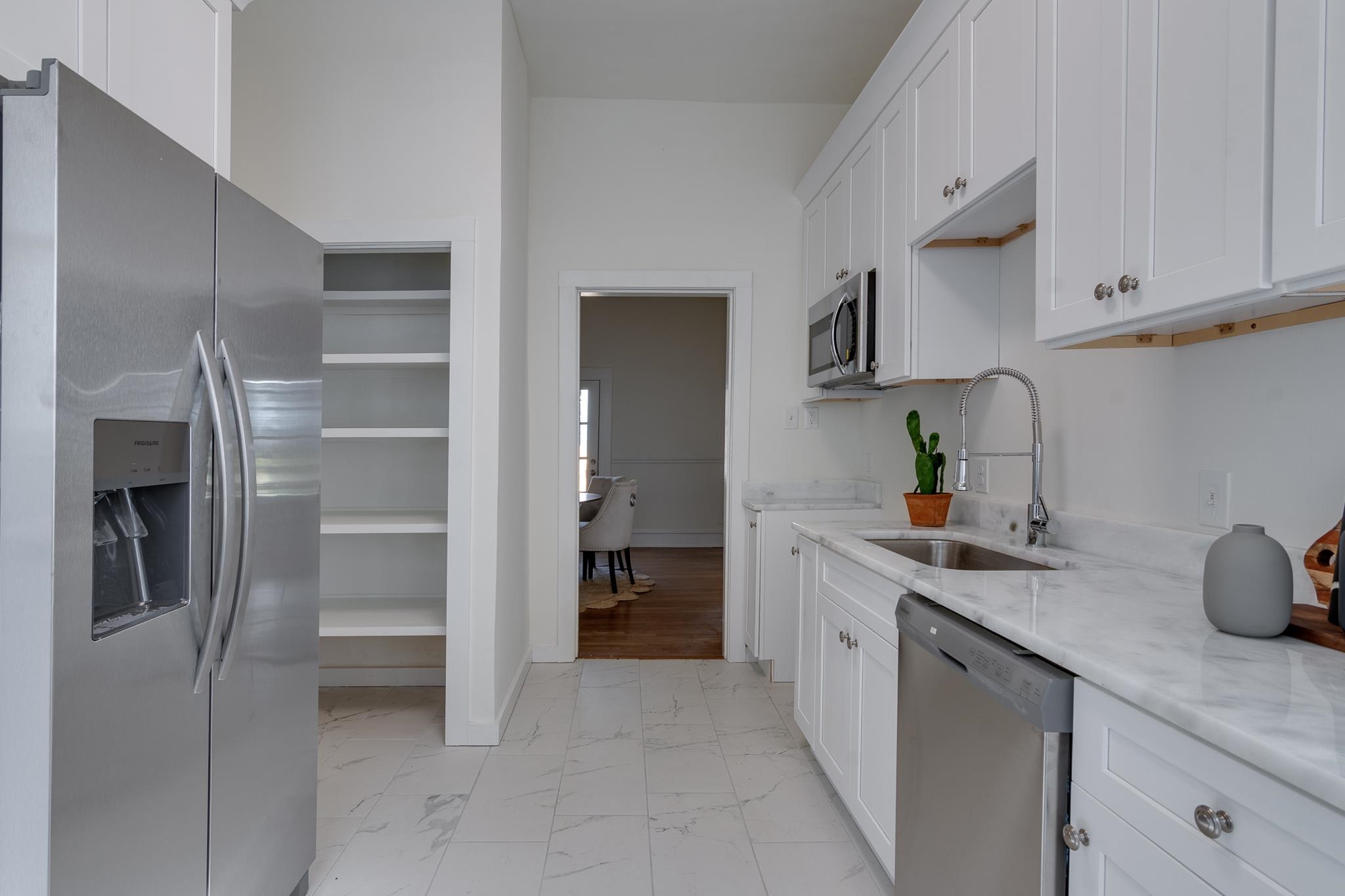 513 South Cox Street Memphis, TN 38104 - Photo 16 of 39 a kitchen with stainless steel appliances granite countertop a refrigerator and a sink