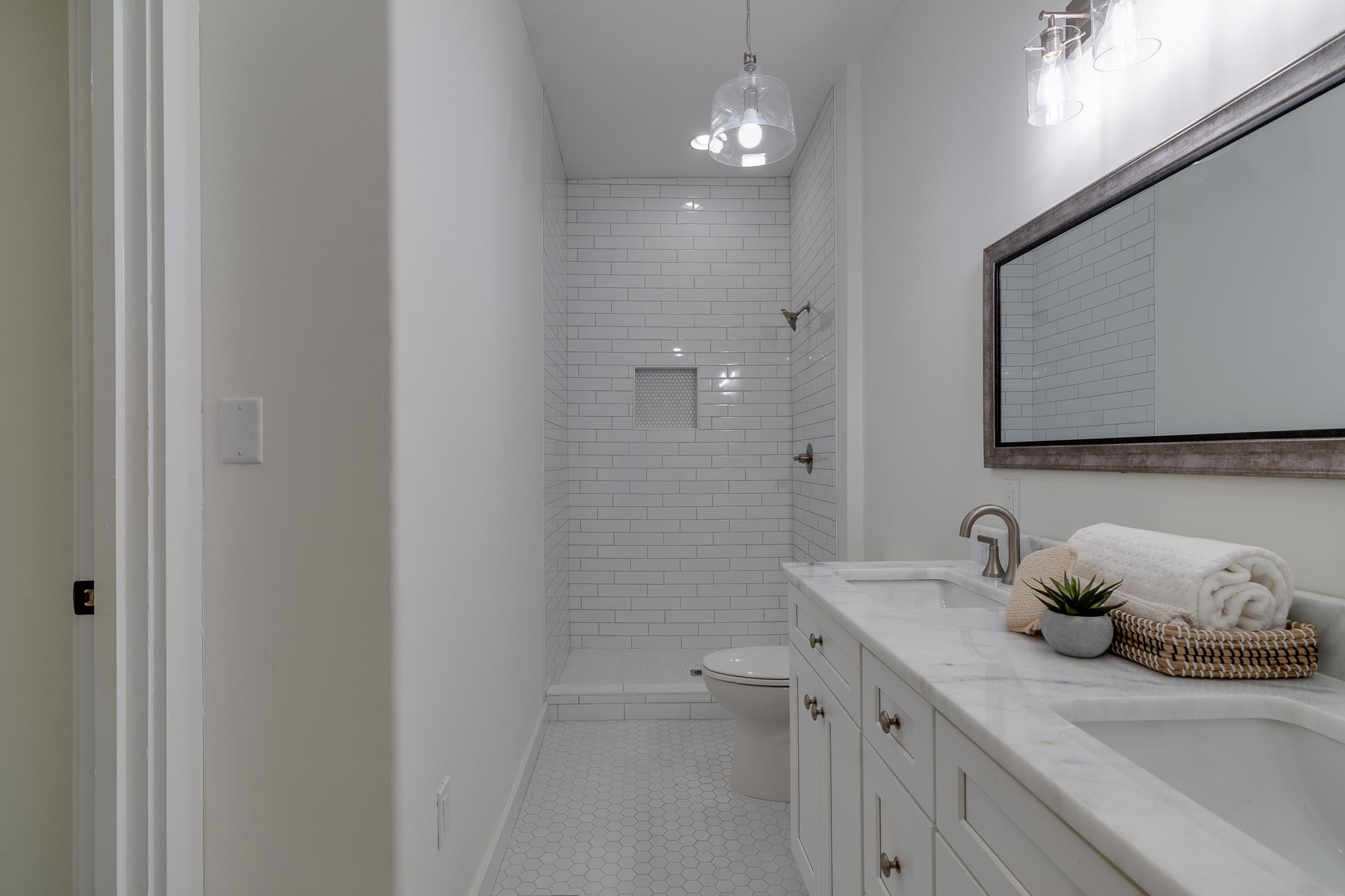 513 South Cox Street Memphis, TN 38104 - Photo 29 of 39 a bathroom with a granite countertop sink a toilet and with shower