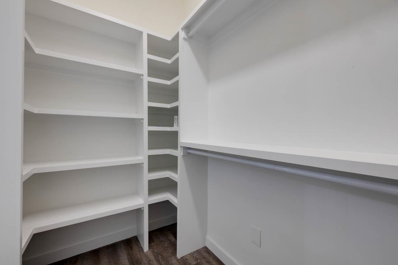 513 South Cox Street Memphis, TN 38104 - Photo 32 of 39 a view of walk in closet with empty racks