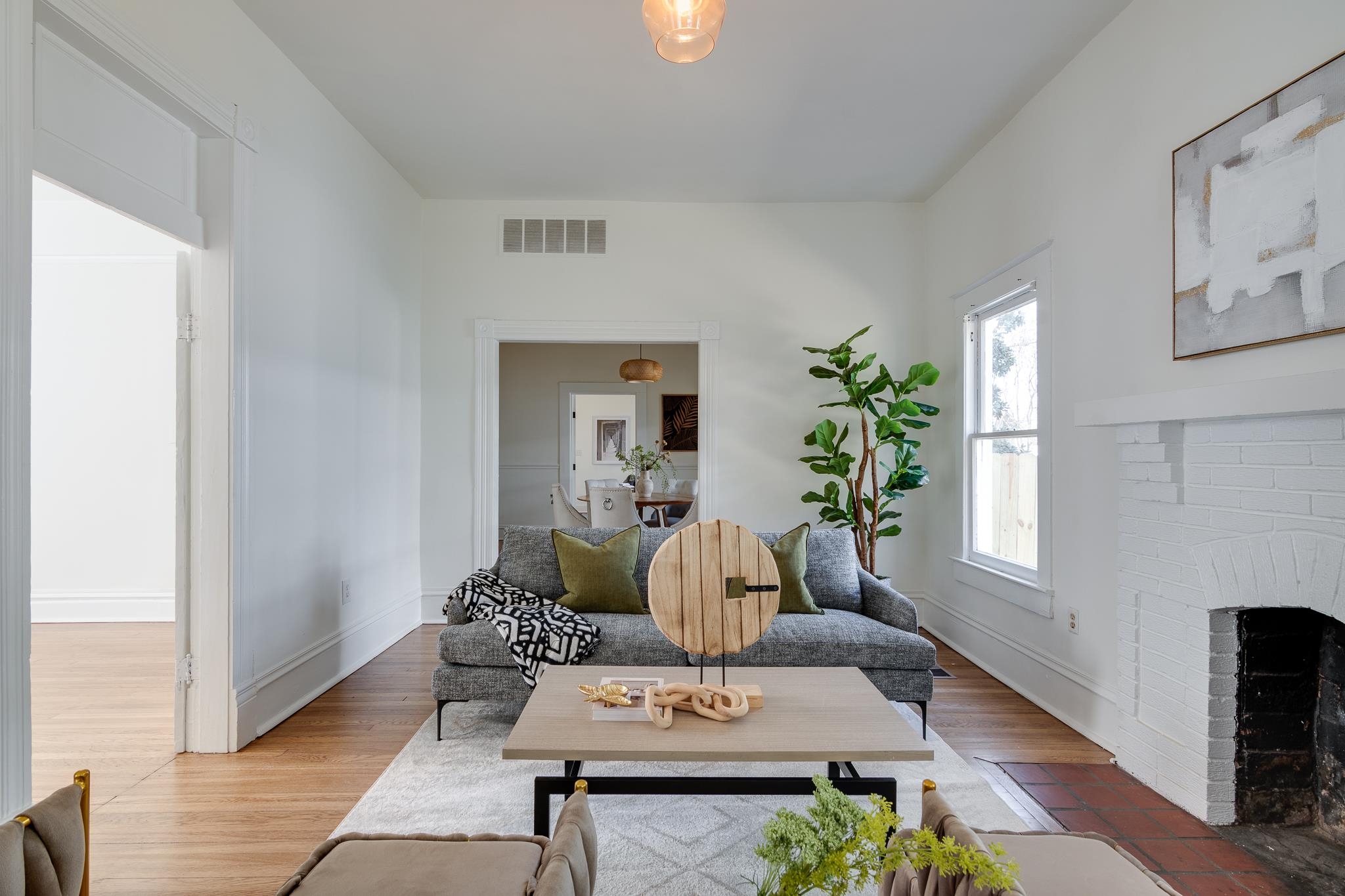 513 South Cox Street Memphis, TN 38104 - Photo 6 of 39 a living room with furniture and a potted plant