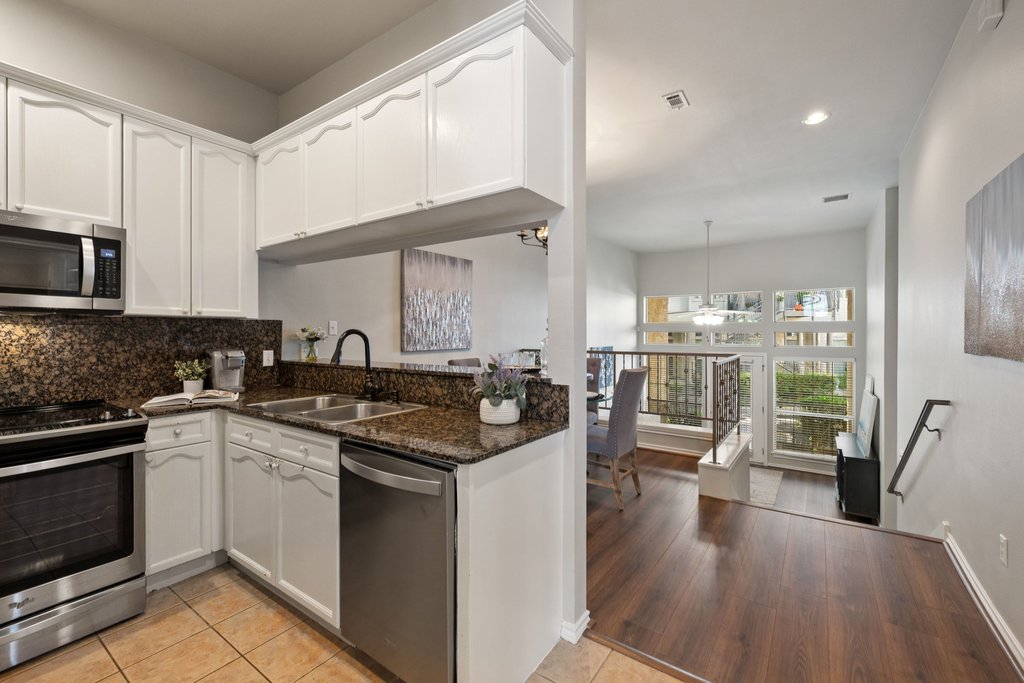 2918 Ranch Road 620 North, Unit 268 Austin, TX 78734 - Photo 20 of 40 Looks from the kitchen into the multi-level dining and living space.