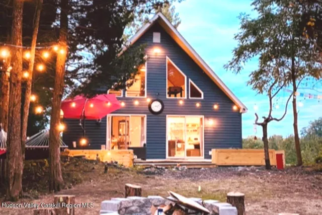 a front view of a house with yard