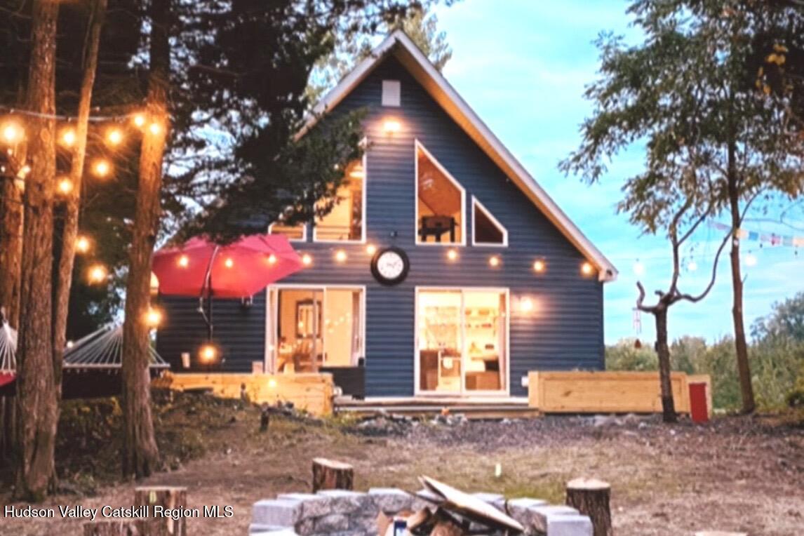 a front view of a house with yard