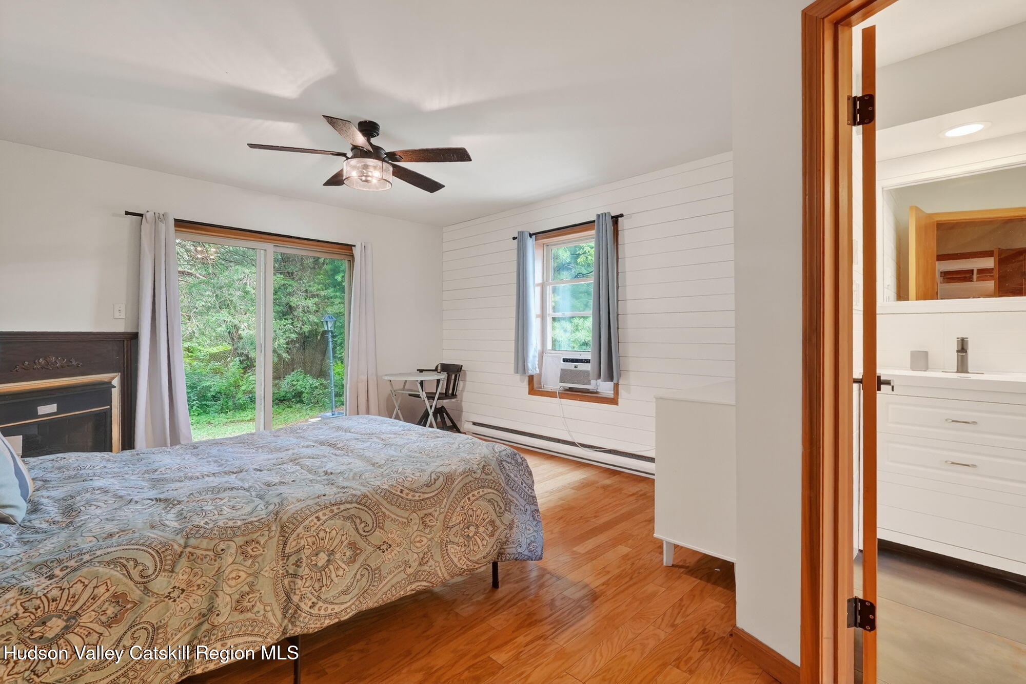 3205 Sleepy Hollow Road Athens, NY 12015 - Photo 16 of 35 a spacious bedroom with a bed and a window