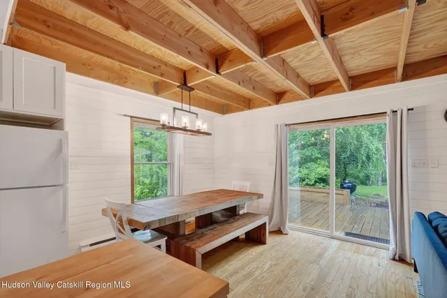 a spacious bedroom with a bed and a window