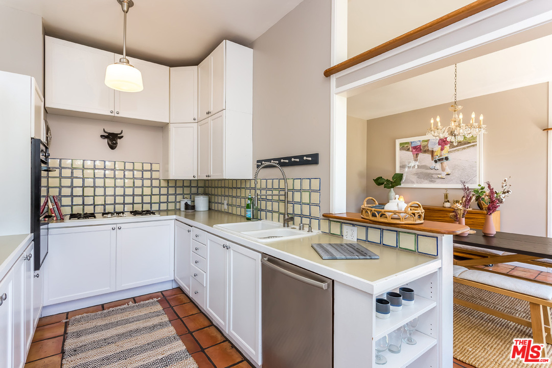 754 Marco Place Venice, CA 90291 - Photo 11 of 39 a kitchen that has a sink and a stove in it
