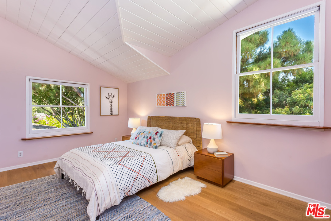 754 Marco Place Venice, CA 90291 - Photo 20 of 39 a bedroom with a bed and a window