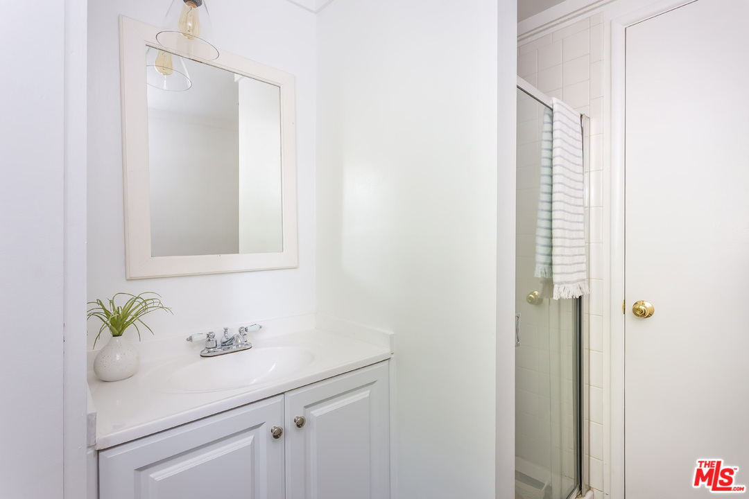 754 Marco Place Venice, CA 90291 - Photo 32 of 39 a bathroom with a sink and a mirror