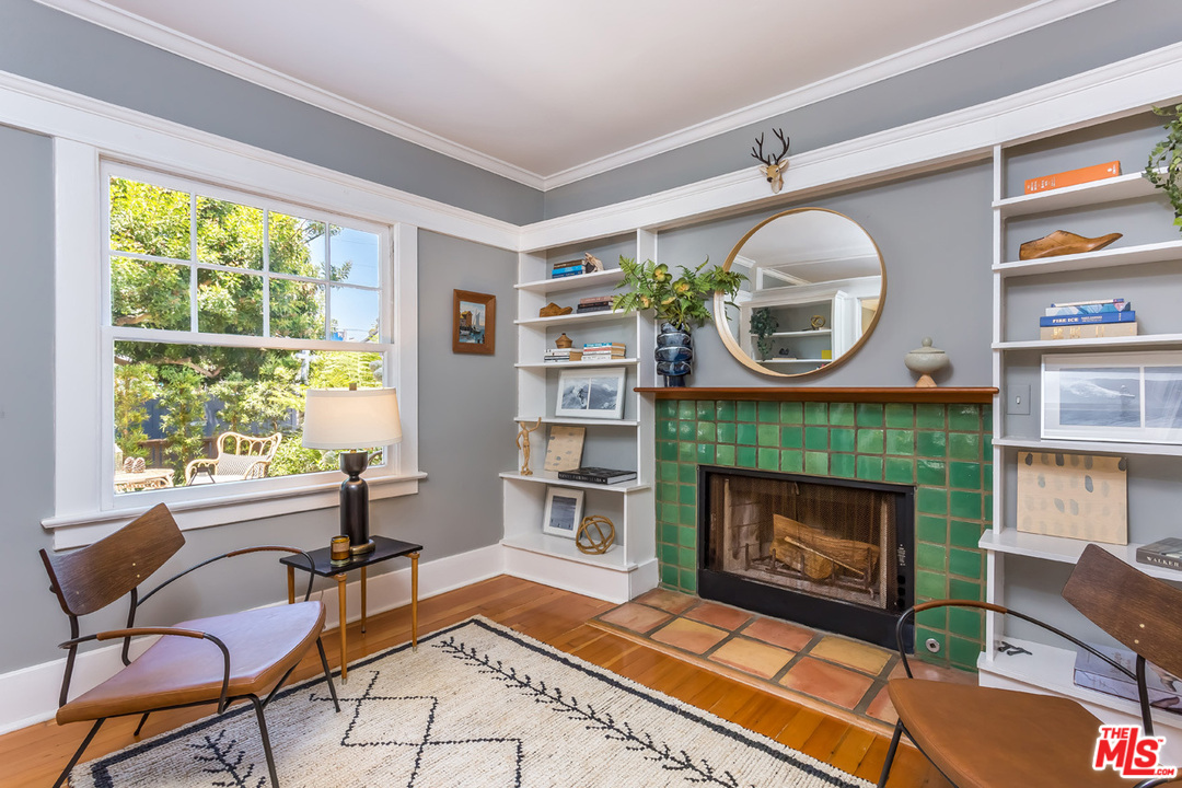 754 Marco Place Venice, CA 90291 - Photo 5 of 39 a living room with furniture a window and a fireplace