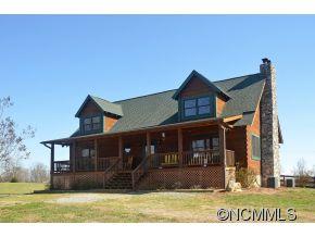 206 Burt Blackwell Road Mill Spring, NC 28756 - Photo 1 of 16 a front view of a house with a yard