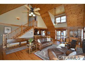 206 Burt Blackwell Road Mill Spring, NC 28756 - Photo 2 of 16 a living room with furniture and wooden floor