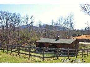 206 Burt Blackwell Road Mill Spring, NC 28756 - Photo 12 of 16 a view of house with a yard