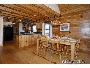 206 Burt Blackwell Road Mill Spring, NC 28756 - Photo 3 of 16 a view of a dining area with furniture and chandelier