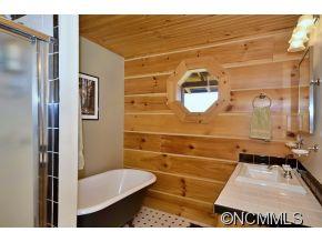206 Burt Blackwell Road Mill Spring, NC 28756 - Photo 6 of 16 a bathroom with a sink and a mirror