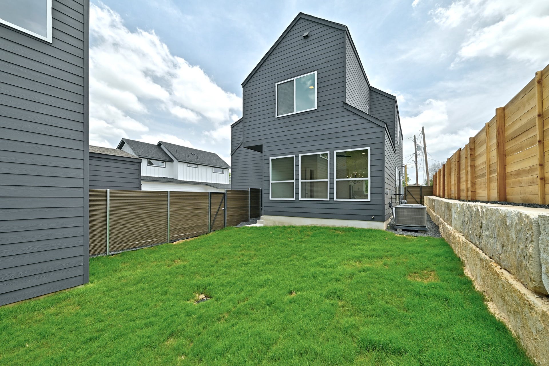 2308 Maxwell Lane, Unit 1 Austin, TX 78741 - Photo 17 of 20 Rear view of house with a fenced backyard.
