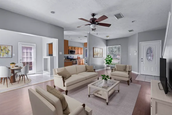 a living room with furniture and a flat screen tv